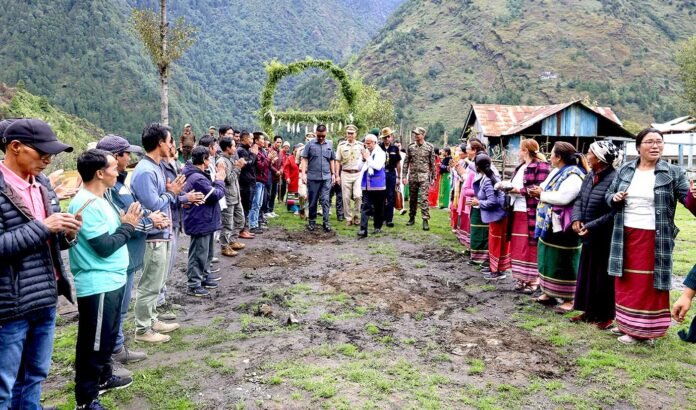 Residents of Taksing in Arunachal Pradesh participate in a community meeting while reaffirming the importance of verified information regarding border developments.