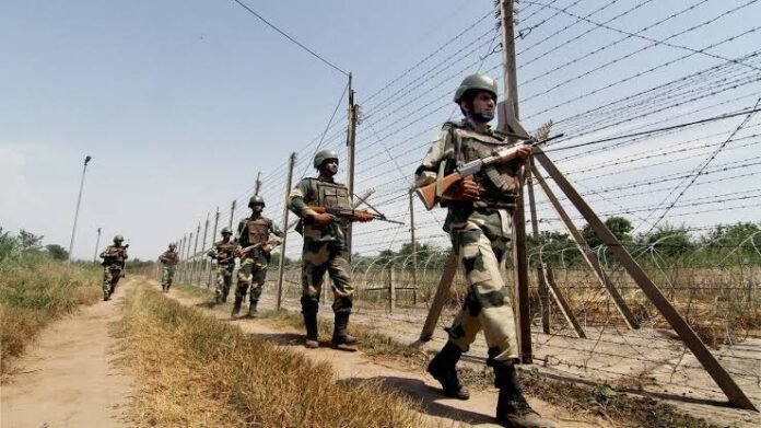 Security personnel monitor a border area in Jorhat following reports of disruption to a road construction project.