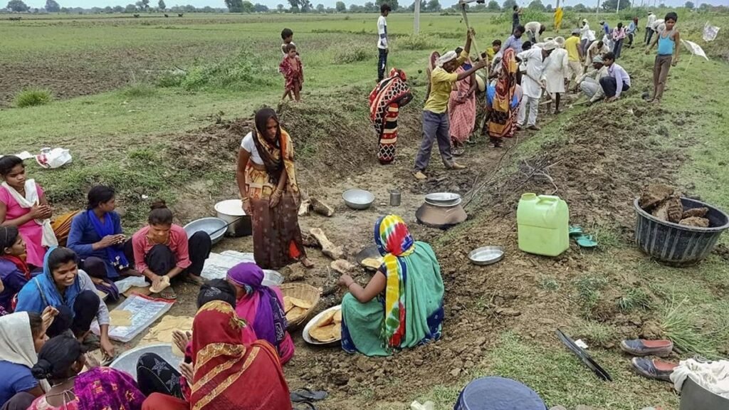 Rural workers in Manipur participating in government-supported employment projects under the expanded 125-day job guarantee scheme.