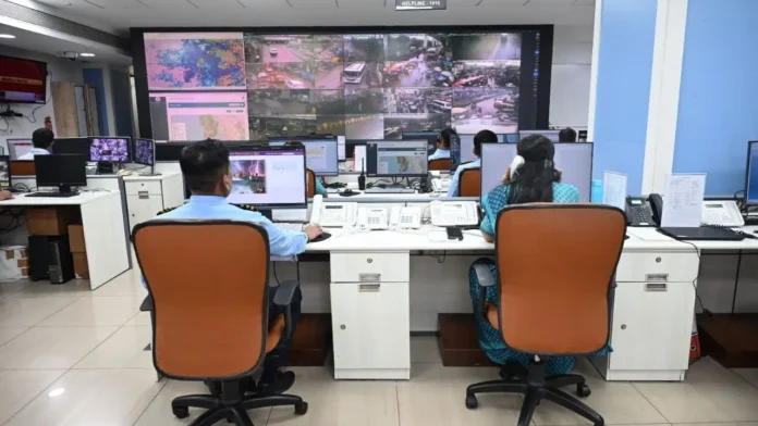 Officials monitor weather data inside a 24/7 Emergency Weather Operations Room at the Secretariat after the launch of the Disaster Helpline.