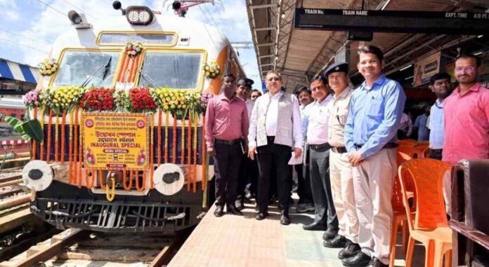 An electric locomotive travels along a fully electrified railway line in Tripura after the Northeast Frontier Railway completed electrification of all 271 kilometres of track.