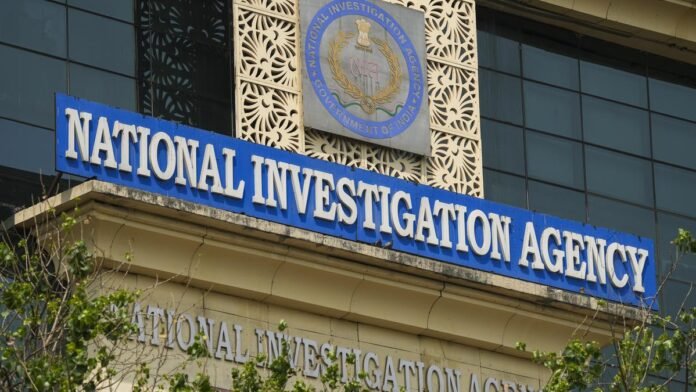 National Investigation Agency officials submit legal documents as part of a court case involving an alleged terror-conspiracy investigation.