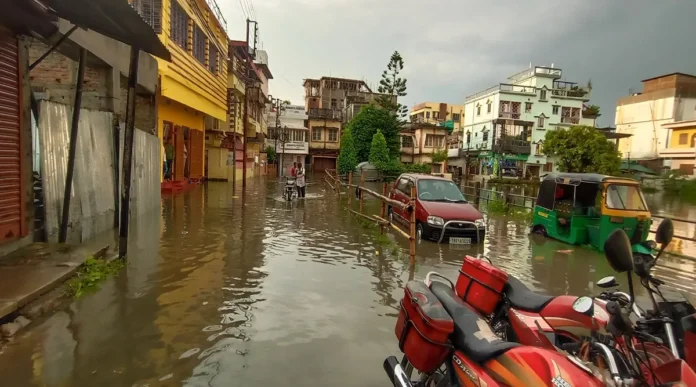 High-capacity water pumps operate on a waterlogged street in Agartala as municipal workers clear accumulated rainwater during the monsoon season.