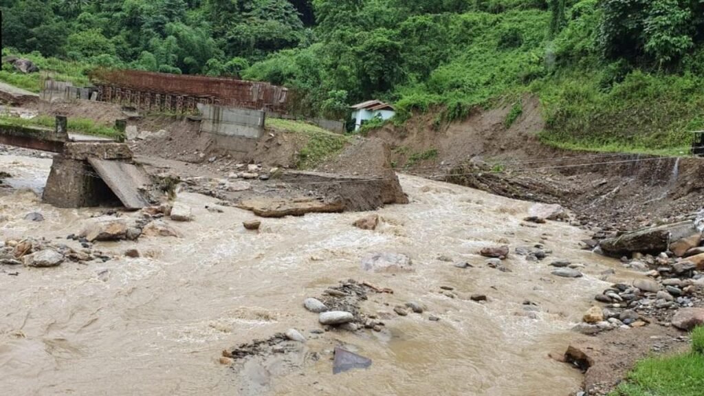 Engineers inspect flood-damaged sections of the Roing–Anini road during infrastructure restoration efforts in Arunachal Pradesh.