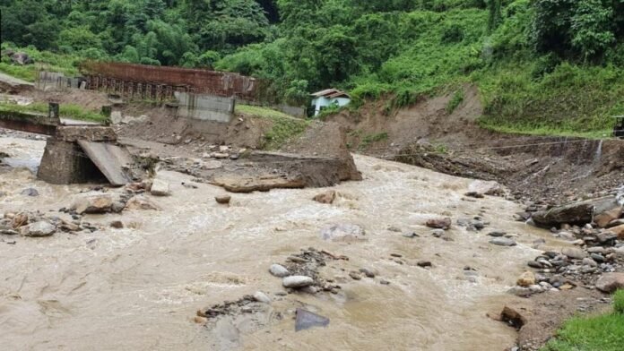 Engineers inspect flood-damaged sections of the Roing–Anini road during infrastructure restoration efforts in Arunachal Pradesh.
