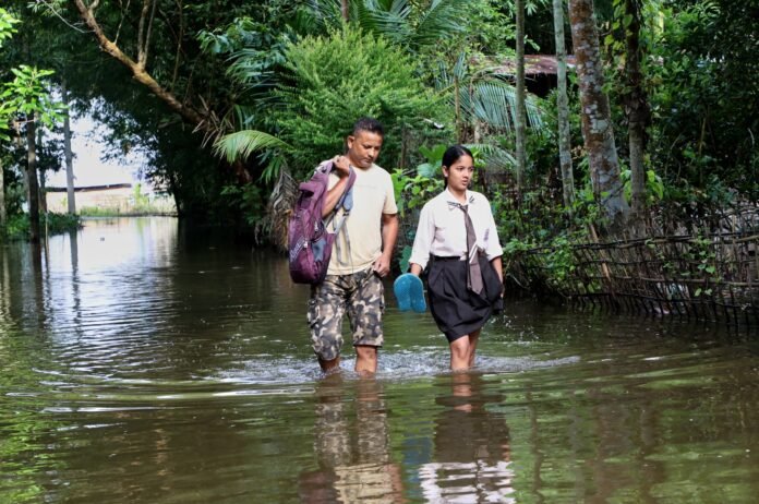 Floodwaters spread across Assam after seven reported embankment breaches as the state's reported flood death toll reaches 95.
