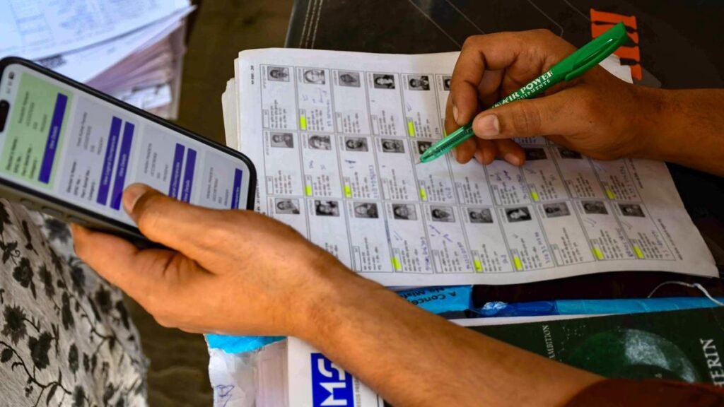 Election officials conducting voter verification as Karnataka prepares the final electoral roll under the Special Intensive Revision process.