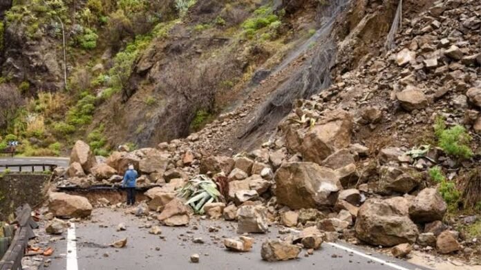 Landslide debris along the newly cut Naga–Tosa Road in North Sikkim creates temporary water accumulation resembling a lake in the Naga Forest area.