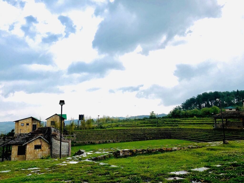 Khasi Heritage Village and surrounding Mawphlang landscape showcasing traditional Khasi architecture and eco-tourism development in Meghalaya.