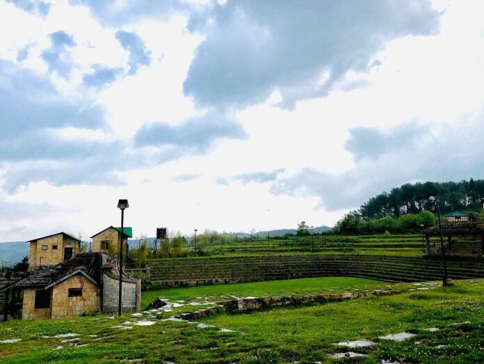Khasi Heritage Village and surrounding Mawphlang landscape showcasing traditional Khasi architecture and eco-tourism development in Meghalaya.