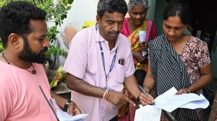 Booth Level Officers conducting coordination activities with political party booth agents during the electoral roll revision process in Tripura.